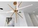 Contemporary chandelier with modern art in a hallway at 1766 Alaqua Dr, Longwood, FL 32779