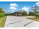 A contemporary home with large driveway, manicured lawn, and three car garage at 1766 Alaqua Dr, Longwood, FL 32779