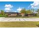 Stunning home showcasing a contemporary design, lush landscaping, and a decorative driveway at 1766 Alaqua Dr, Longwood, FL 32779