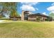 Stylish home exterior featuring manicured lawn and tasteful landscaping at 1766 Alaqua Dr, Longwood, FL 32779