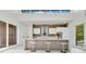 Bright modern kitchen with large island, stainless hood, brick backsplash, and lots of natural light at 1766 Alaqua Dr, Longwood, FL 32779