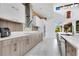 Modern kitchen features a stylish range hood, stainless steel appliances and ample storage at 1766 Alaqua Dr, Longwood, FL 32779