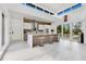 Open concept kitchen with stainless steel appliances, large island and high ceiling at 1766 Alaqua Dr, Longwood, FL 32779