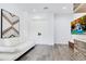 Modern living room with sleek sofa, decorative art, and a stone accent wall, ideal for entertaining at 1766 Alaqua Dr, Longwood, FL 32779