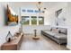 Modern living room with decorative lighting, sleek furniture, and a view of the outdoors at 1766 Alaqua Dr, Longwood, FL 32779