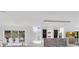 Open-concept living area connects to the dining area, bar, and offers views of the backyard at 1766 Alaqua Dr, Longwood, FL 32779