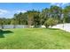 Expansive backyard featuring lush green grass and mature trees with a privacy fence at 199 Boysenberry Ln, Daytona Beach, FL 32124