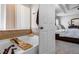 Relaxing bathroom with a soaking tub, neutral tiling, and a view of the bedroom at 199 Boysenberry Ln, Daytona Beach, FL 32124