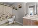 Cozy bathroom featuring a patterned shower curtain and a neutral color scheme at 199 Boysenberry Ln, Daytona Beach, FL 32124