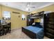 Bright bedroom featuring a wooden bunk bed and a desk next to windows with natural light at 199 Boysenberry Ln, Daytona Beach, FL 32124