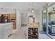 Bright kitchen features an island with wine storage at 199 Boysenberry Ln, Daytona Beach, FL 32124