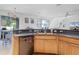 Bright kitchen featuring wooden cabinets, stainless steel appliances, and breakfast bar seating at 199 Boysenberry Ln, Daytona Beach, FL 32124