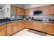 Well-lit kitchen with ample counter space and wooden cabinetry at 199 Boysenberry Ln, Daytona Beach, FL 32124