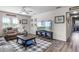 Cozy living room featuring plush seating, a large screen TV, and stylish décor at 199 Boysenberry Ln, Daytona Beach, FL 32124