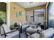 Inviting screened patio with cozy seating, perfect for outdoor entertaining at 199 Boysenberry Ln, Daytona Beach, FL 32124