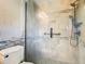 Bright bathroom with a tiled shower, a chrome shower head with rainfall, and a glass door for a modern touch at 200 Saint Andrews Blvd # 1004, Winter Park, FL 32792