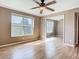 Bedroom with hardwood flooring, natural light, and a mirrored closet at 200 Saint Andrews Blvd # 1004, Winter Park, FL 32792
