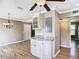 Dining area featuring granite countertops, white cabinets, and plenty of room for storage at 200 Saint Andrews Blvd # 1004, Winter Park, FL 32792