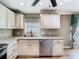 Close up of the kitchen sink, countertop, and stainless steel appliances at 200 Saint Andrews Blvd # 1004, Winter Park, FL 32792