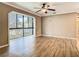 Bright and airy living room with a large window offering views of the surrounding landscape at 200 Saint Andrews Blvd # 1004, Winter Park, FL 32792