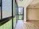 View of the living room featuring a wall of windows with views of mature landscaping at 200 Saint Andrews Blvd # 1004, Winter Park, FL 32792