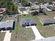 An aerial view of a modern home featuring a spacious layout, attached garage, and a long driveway at 2082 Sw 153Rd Loop, Ocala, FL 34473