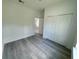 Neat bedroom featuring gray flooring and a large closet with double doors at 2082 Sw 153Rd Loop, Ocala, FL 34473