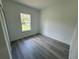 Cozy bedroom with durable gray flooring and a bright window at 2082 Sw 153Rd Loop, Ocala, FL 34473