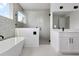 Spacious bathroom features soaking tub, glass enclosed shower and large vanity at 2408 Lafayette Ave, Winter Park, FL 32789