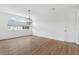 Bright bedroom features beautiful hardwood floors, modern light fixture, and large window at 2408 Lafayette Ave, Winter Park, FL 32789