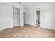 Clean bedroom offers natural light, hardwood flooring and ensuite bath and closet at 2408 Lafayette Ave, Winter Park, FL 32789