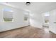 Bright bedroom with three large windows, neutral color palette, and hardwood floors at 2408 Lafayette Ave, Winter Park, FL 32789