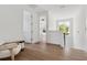 Upstairs hallway features hardwood floors and natural light from large windows at 2408 Lafayette Ave, Winter Park, FL 32789