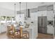 Well-lit kitchen featuring a large island, stainless steel appliances, and ample cabinet space at 2408 Lafayette Ave, Winter Park, FL 32789