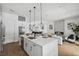Spacious open kitchen overlooking the living room featuring an island and modern appliances at 2408 Lafayette Ave, Winter Park, FL 32789