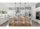Modern kitchen with white cabinetry, stainless steel appliances, and a large center island at 2408 Lafayette Ave, Winter Park, FL 32789
