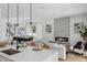 Inviting living area with fireplace, dining set, sofa and open kitchen with modern appliances at 2408 Lafayette Ave, Winter Park, FL 32789