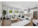 Bright open living area with a modern kitchen, comfortable seating, fireplace, and access to the outdoor space at 2408 Lafayette Ave, Winter Park, FL 32789