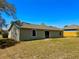 Backyard view showcases the home's siding, and sliding glass door at 2431 Lackland Dr, Deltona, FL 32738
