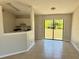 Cozy dining area with a sliding glass door and open access to the kitchen at 2431 Lackland Dr, Deltona, FL 32738