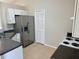 Cozy kitchen with stainless steel appliances and tile flooring at 2431 Lackland Dr, Deltona, FL 32738