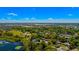 Aerial view of neighborhood and landscape with blue skies and fluffy clouds at 2501 Weber St, Orlando, FL 32803