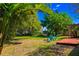 The sprawling backyard with mature trees is ideal for outdoor enjoyment and entertaining at 2501 Weber St, Orlando, FL 32803