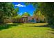 Enjoy the outdoors in this backyard with deck, grill, and ample space for entertaining at 2501 Weber St, Orlando, FL 32803