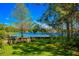 This backyard offers a partial water view and a beautiful place to relax and enjoy nature at 2501 Weber St, Orlando, FL 32803