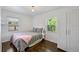 Light-filled bedroom with hardwood floors, closet, and plenty of natural light at 2501 Weber St, Orlando, FL 32803