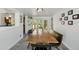 Bright dining room with a long wooden table, perfect for gatherings and meals at 2501 Weber St, Orlando, FL 32803