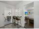 View of bar seating separating the dining and living spaces, offering seamless flow and a modern touch at 2501 Weber St, Orlando, FL 32803