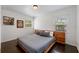 Cozy main bedroom with hardwood floors, natural light, and decorative wall art at 2501 Weber St, Orlando, FL 32803