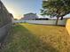 Large backyard with a fence and a house in the background at 2715 Bartlet Dr, Kissimmee, FL 34741